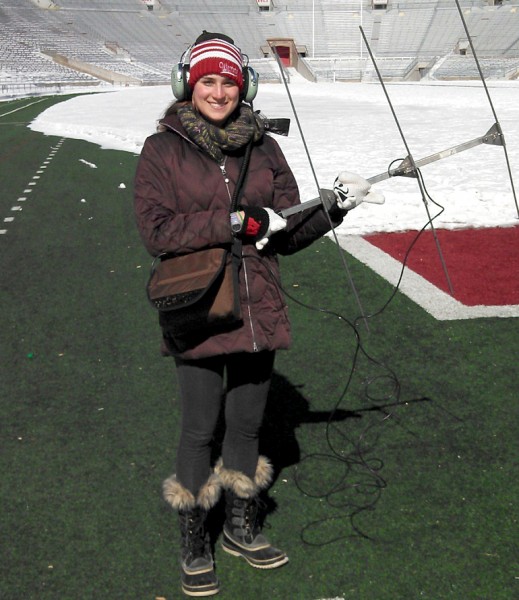 Holly Hovanec tries to locate a radio -collared fox spotted in Camp Randall Stadium. Photo by David Drake.