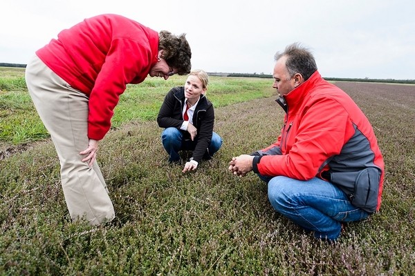 UW-Madison Chancellor Rebecca Blank, left, listens to farmers