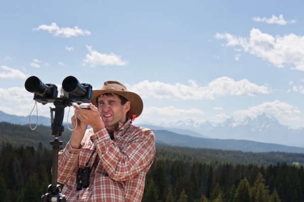 Phil Townsend, Professor of Forest and Wildlife Ecology, collects data about beetle damage to conifers on Togowotee Pass near Wyoming's Grand Teton National Park.